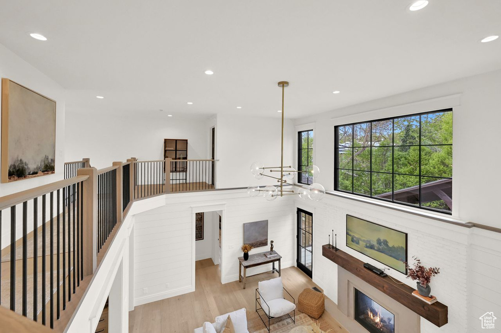 Interior space featuring recessed lighting, an inviting chandelier, and wood finished floors