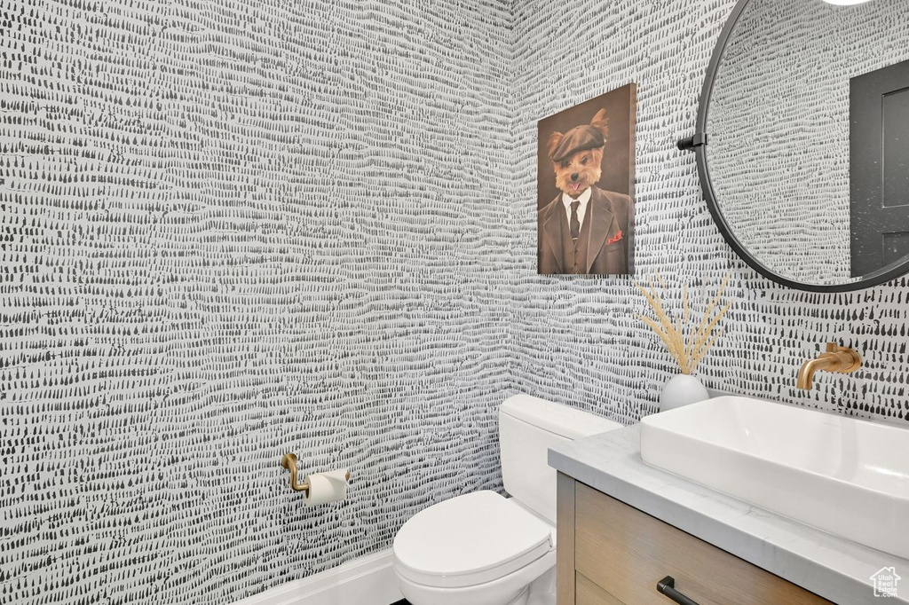 Bathroom featuring vanity and toilet