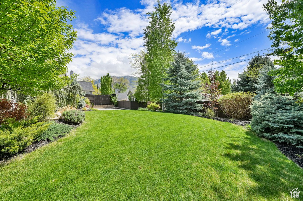 View of yard featuring fence