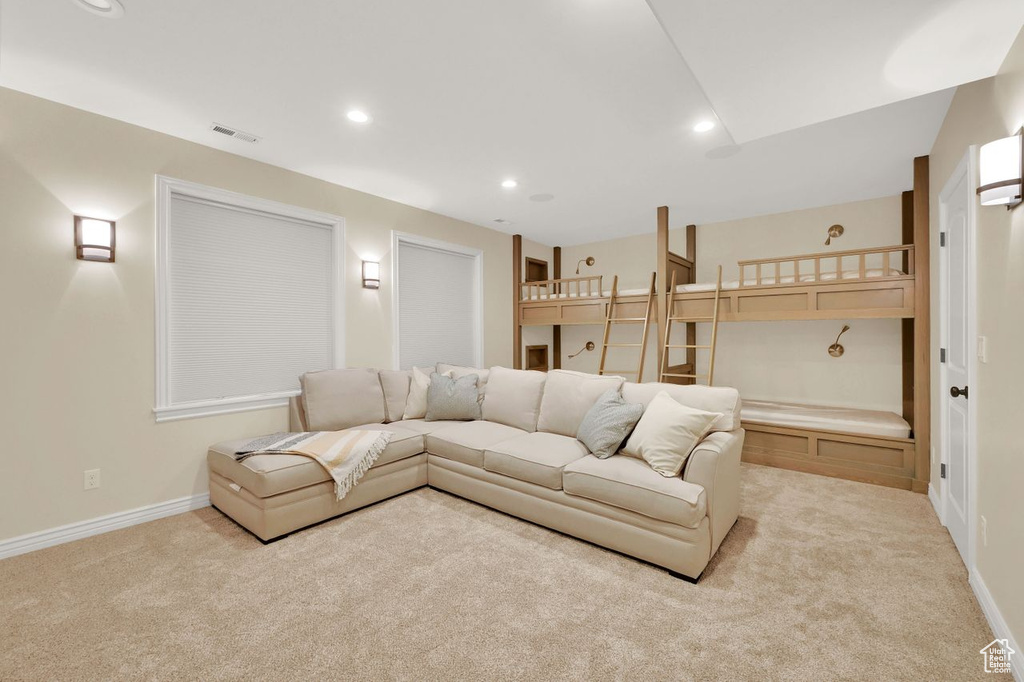 Living room featuring baseboards, carpet, recessed lighting, and visible vents