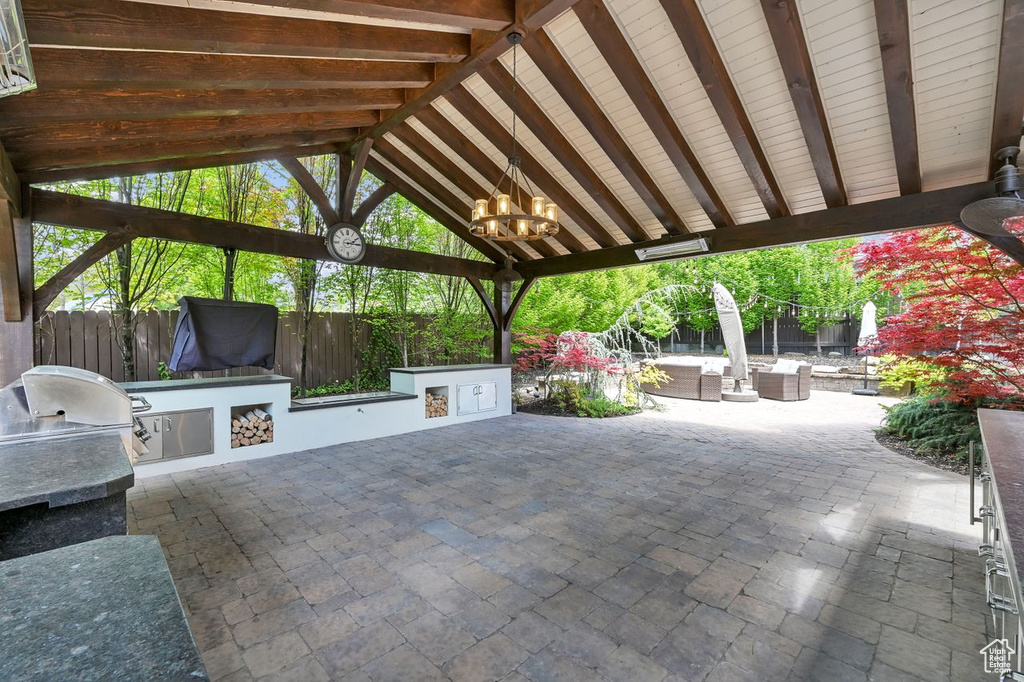 View of patio / terrace featuring a gazebo, fence, an outdoor hangout area, and area for grilling