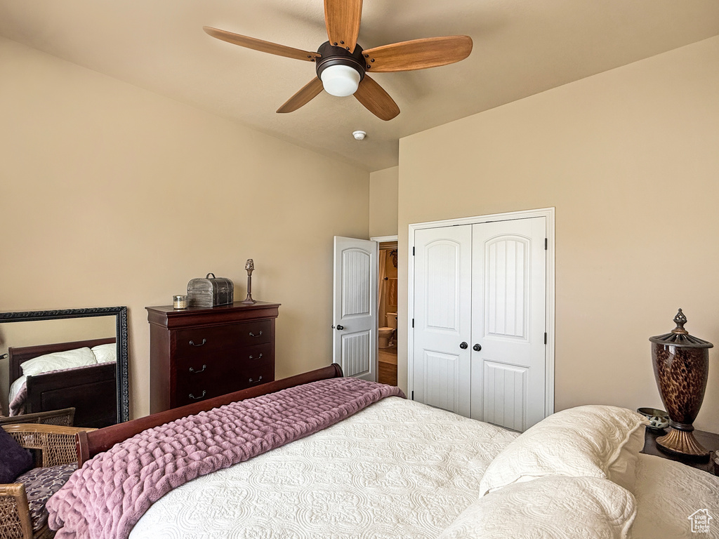 Bedroom featuring a closet, ceiling fan, and vaulted ceiling