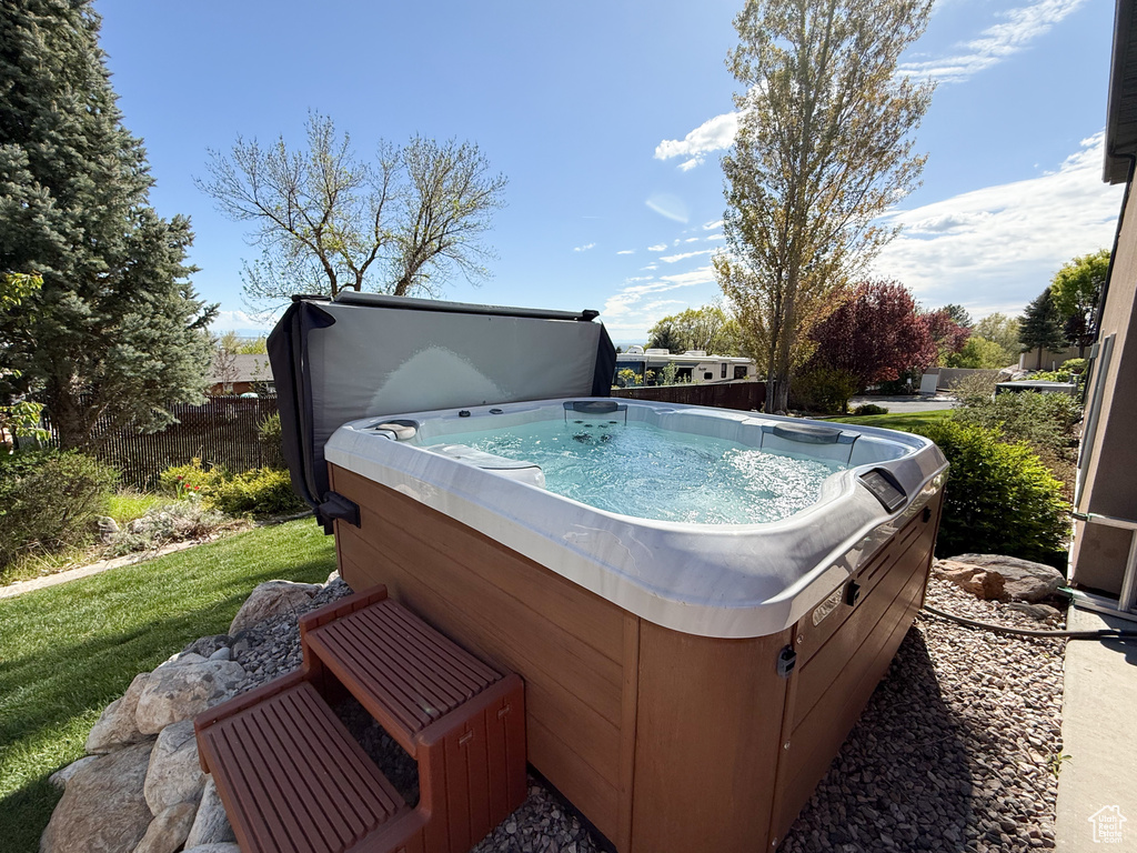 Exterior space with a hot tub