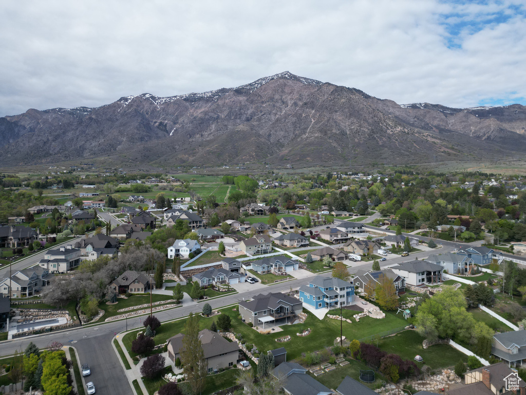 Drone / aerial view with a residential view and a mountain view