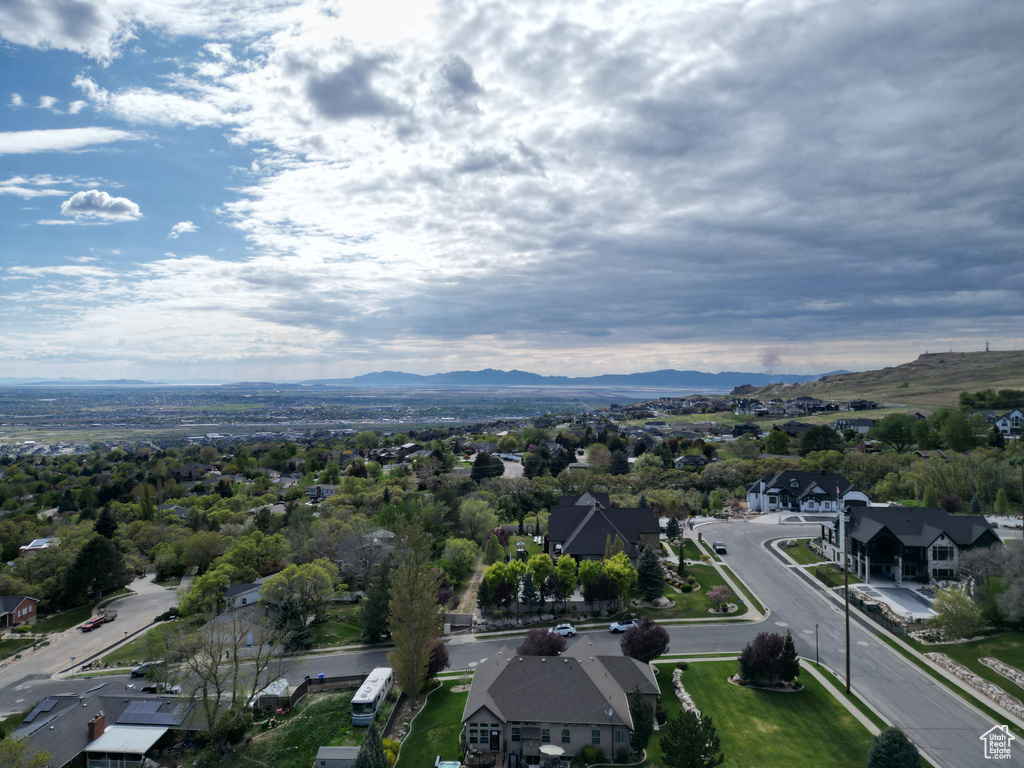 Drone / aerial view with a residential view and a mountain view
