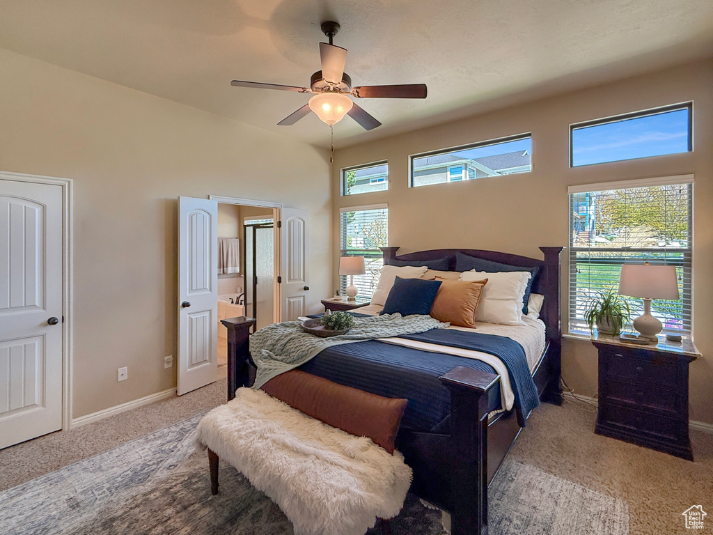 Carpeted bedroom with baseboards and ceiling fan
