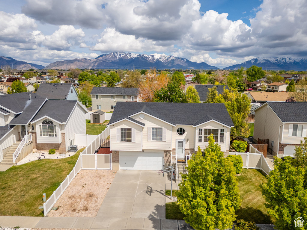 Birds eye view of property featuring a mountain view and a residential view