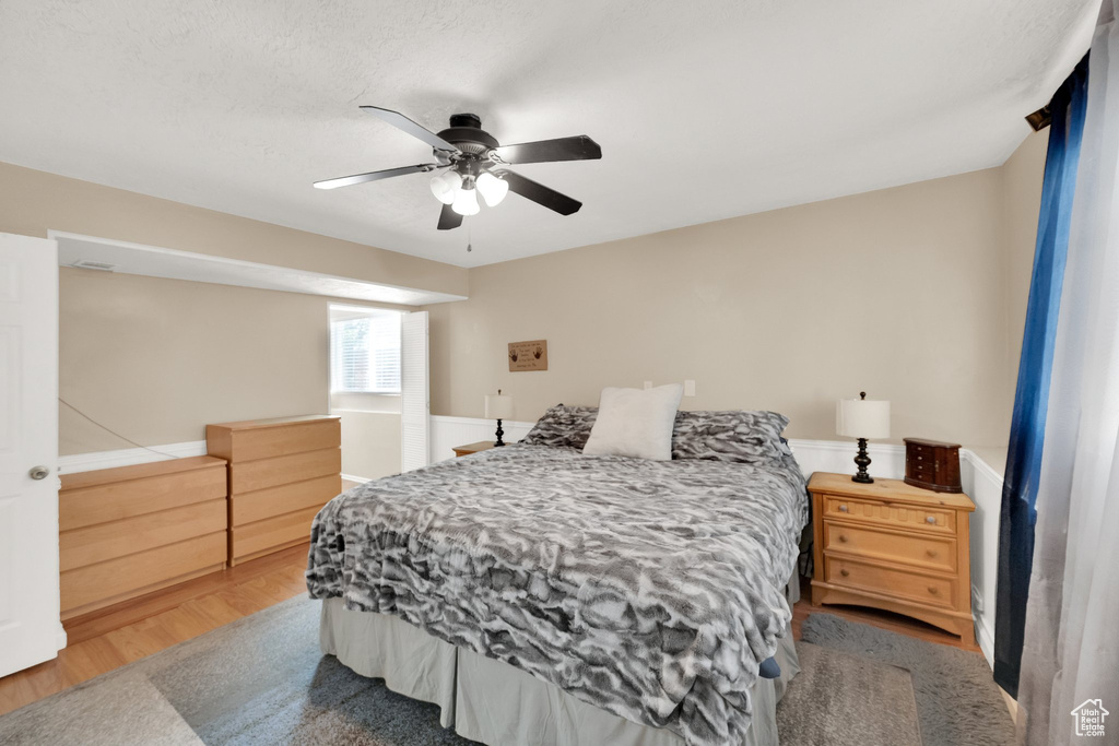 Bedroom featuring a ceiling fan and wood finished floors