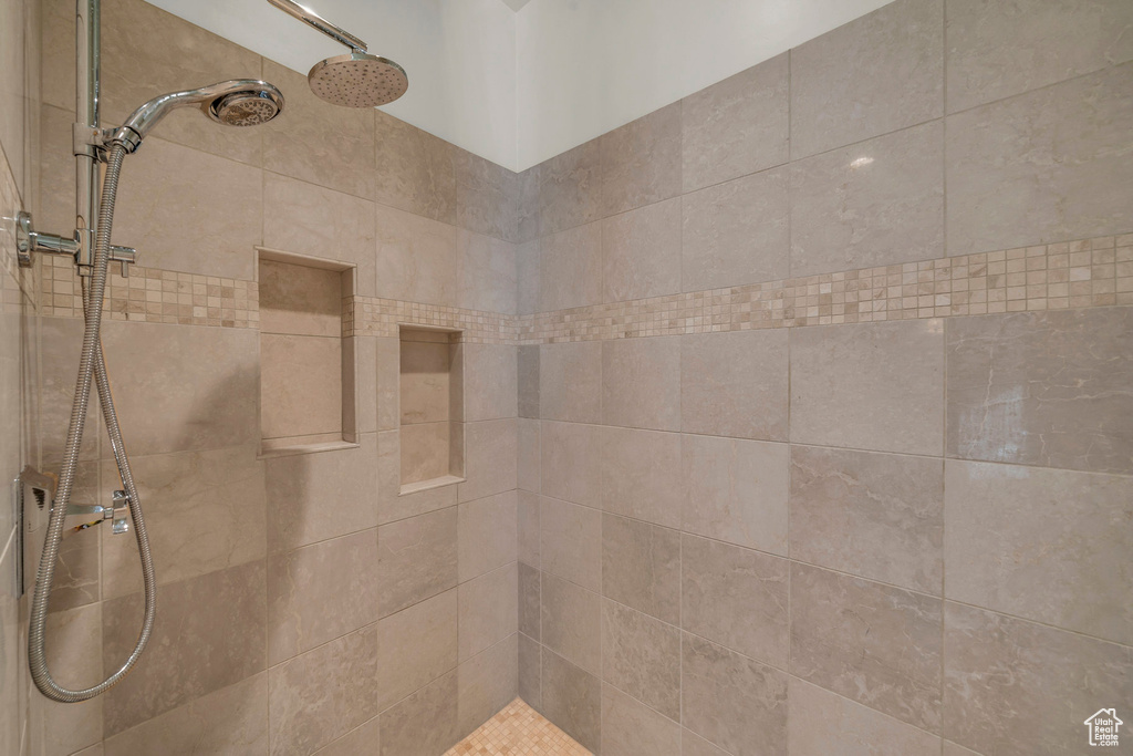 Room details with tiled shower