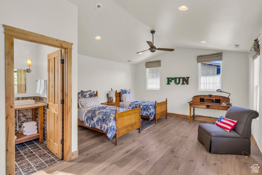 Bedroom with recessed lighting, baseboards, wood finished floors, and lofted ceiling