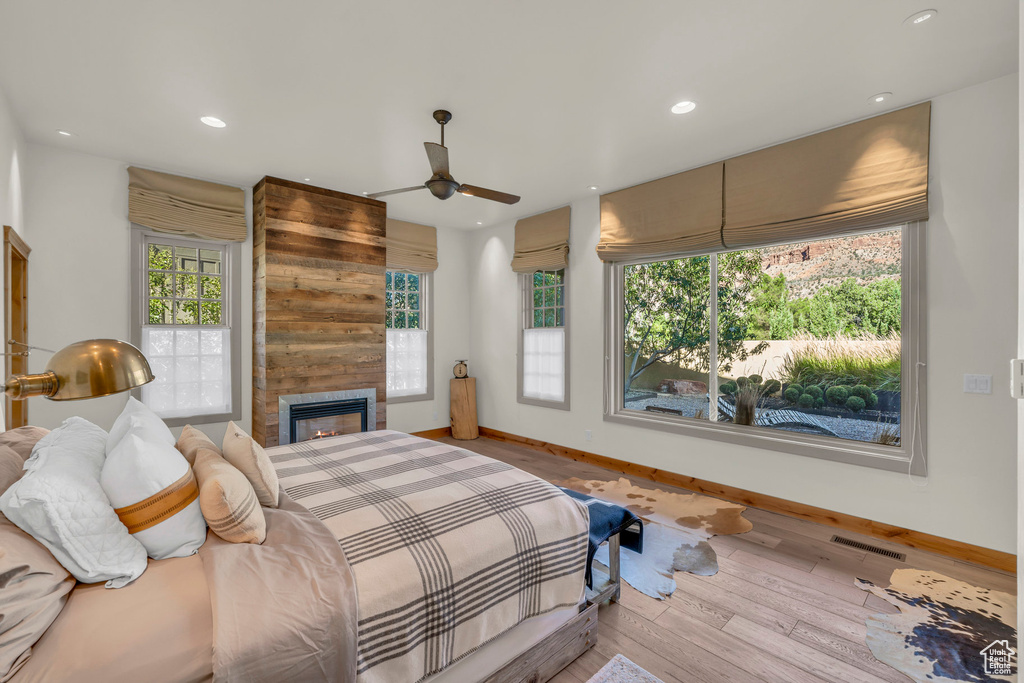 Bedroom featuring multiple windows, recessed lighting, and visible vents