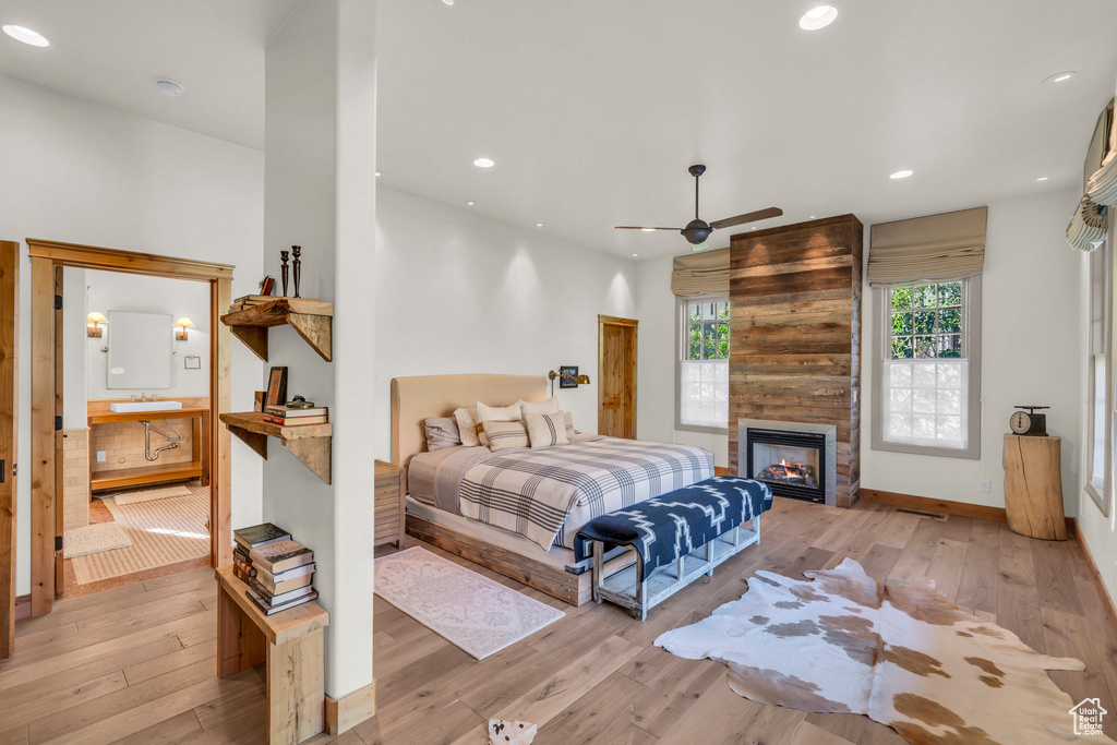 Bedroom with wood-type flooring, recessed lighting, and baseboards