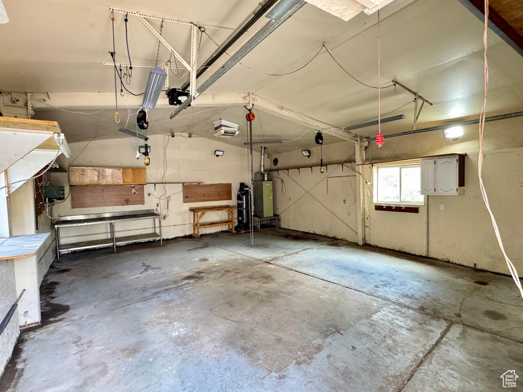 Garage featuring gas water heater
