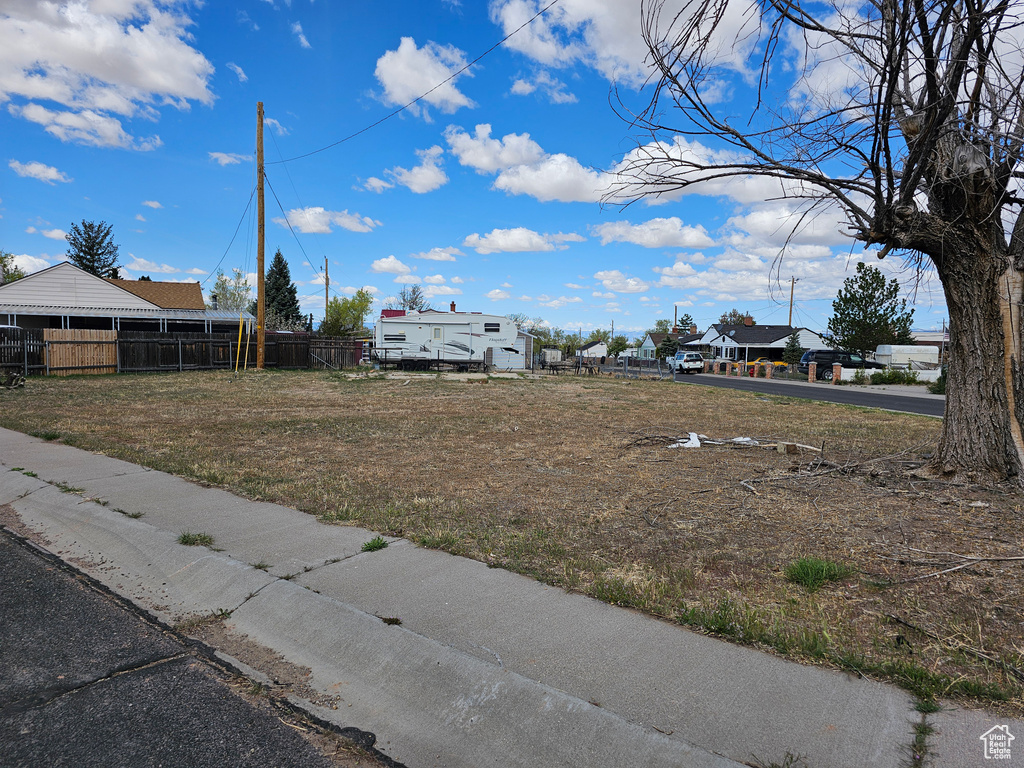 View of yard featuring fence
