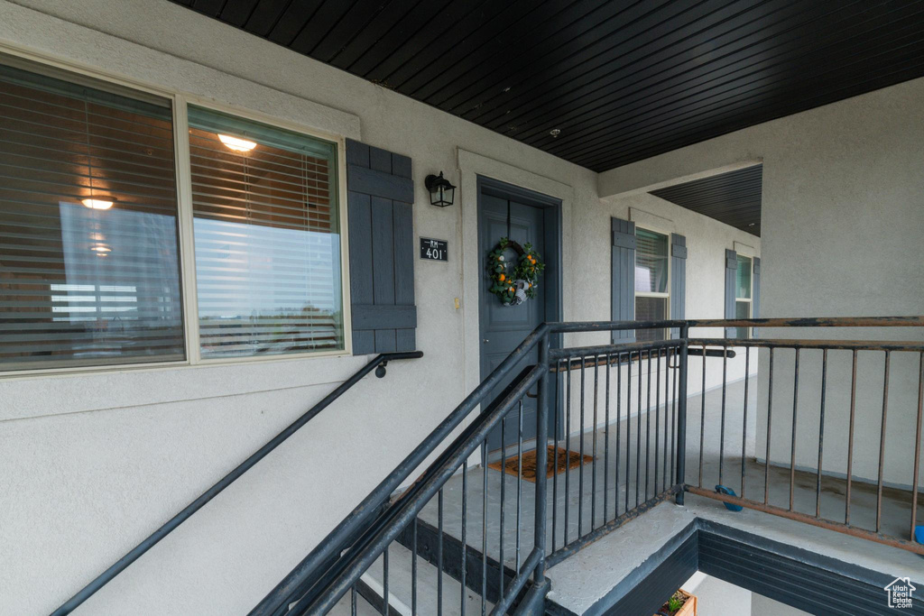 View of exterior entry featuring stucco siding