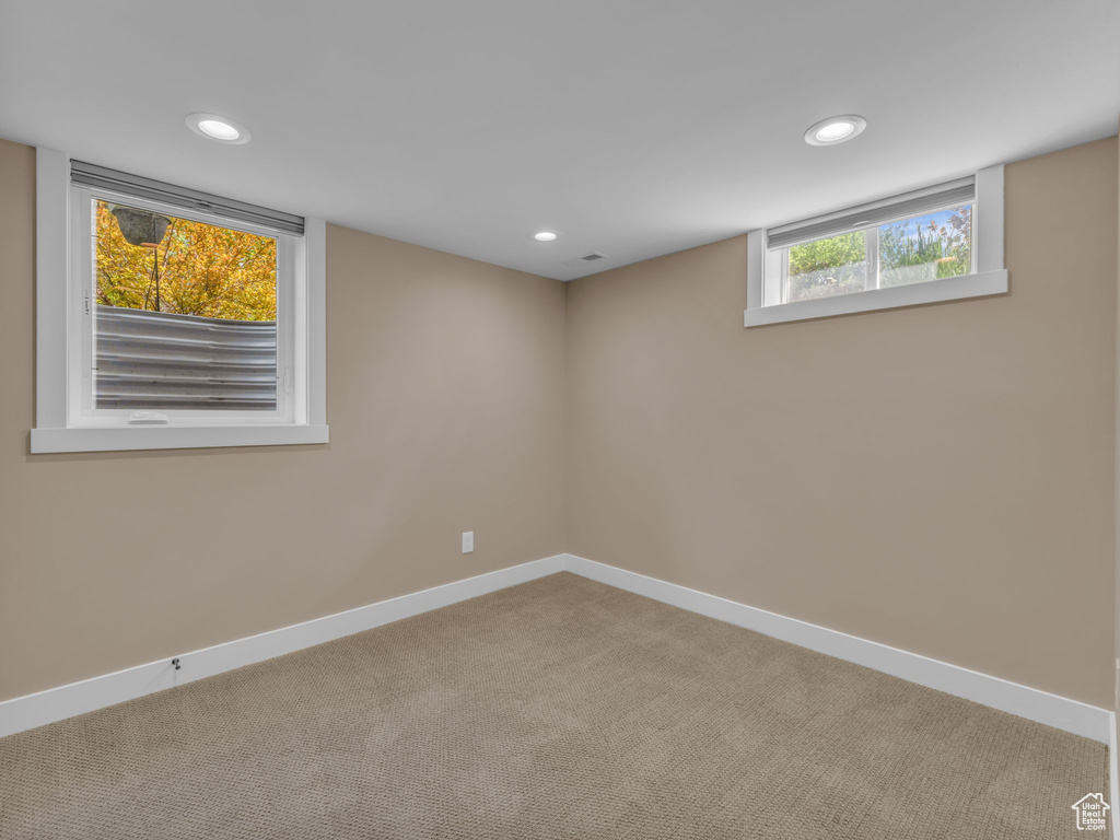 Basement with baseboards, carpet flooring, and recessed lighting