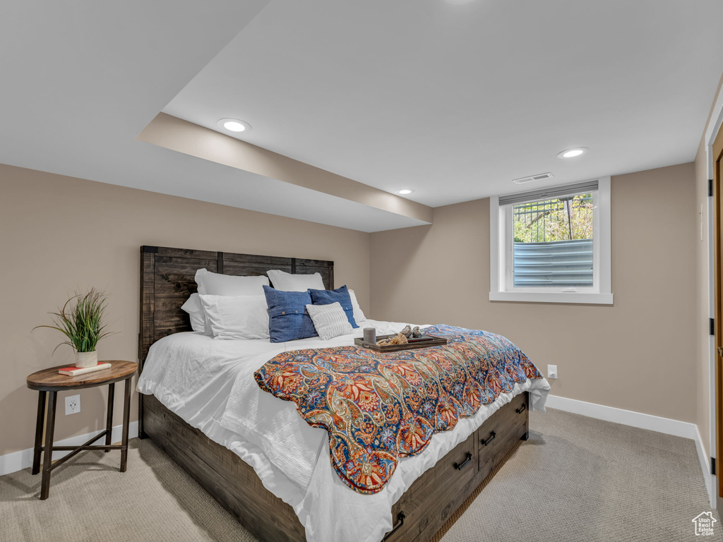 Carpeted bedroom with baseboards, recessed lighting, and visible vents