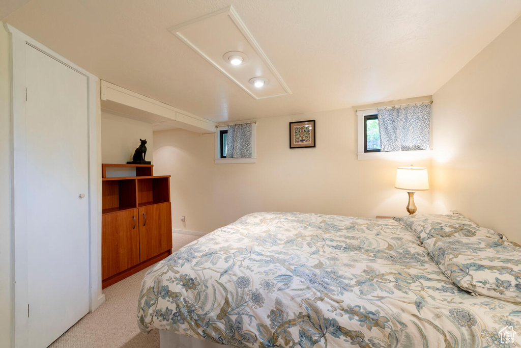 Bedroom with light colored carpet