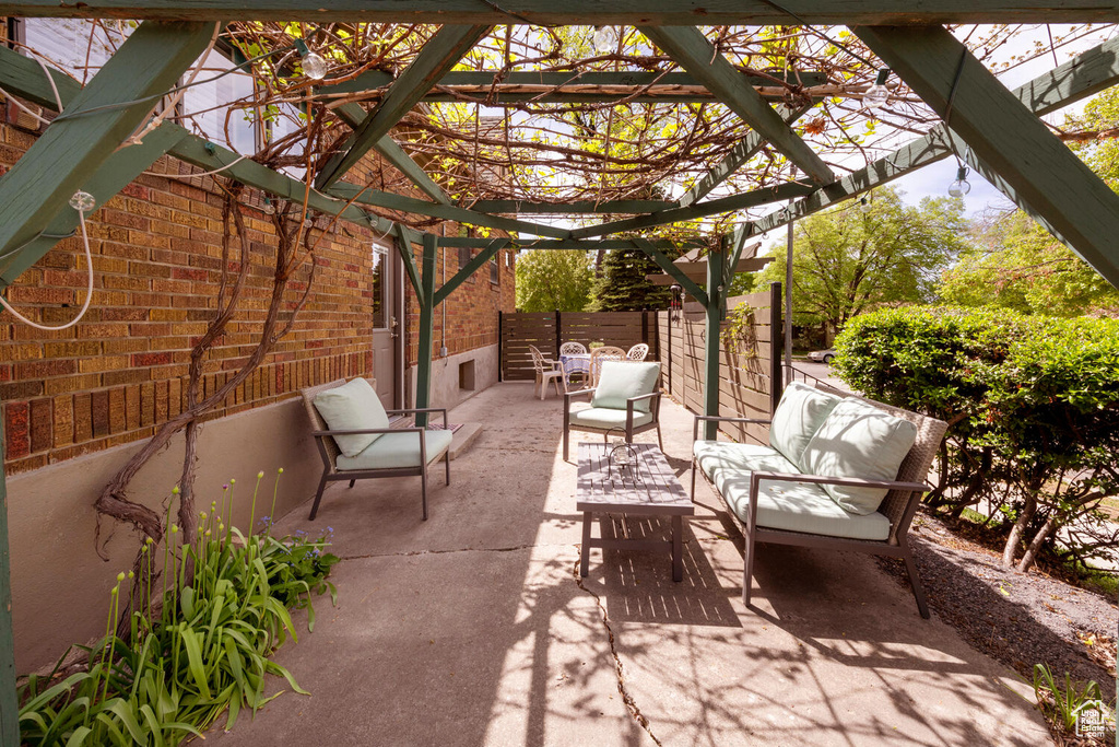 View of patio / terrace with outdoor lounge area and a pergola