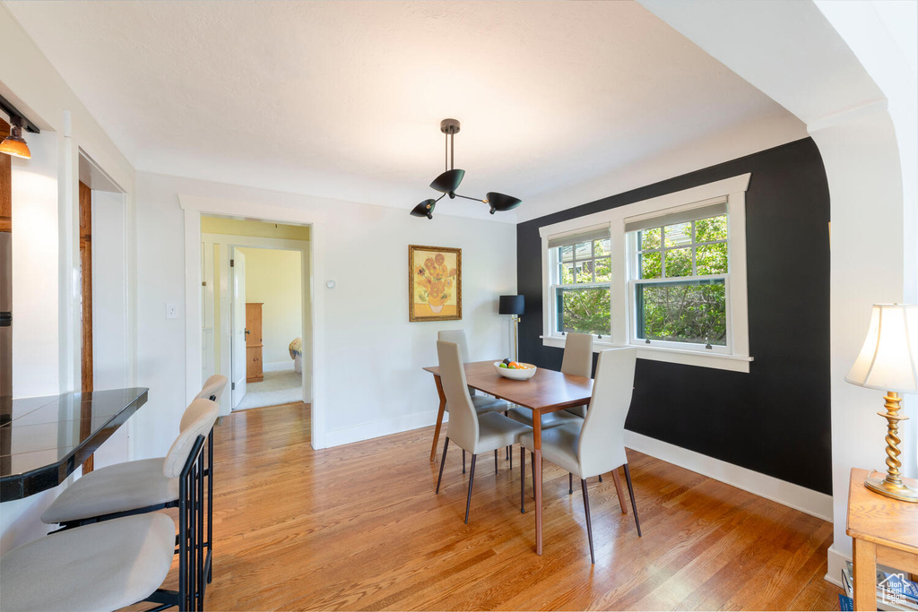 Dining space featuring baseboards and light wood-style floors