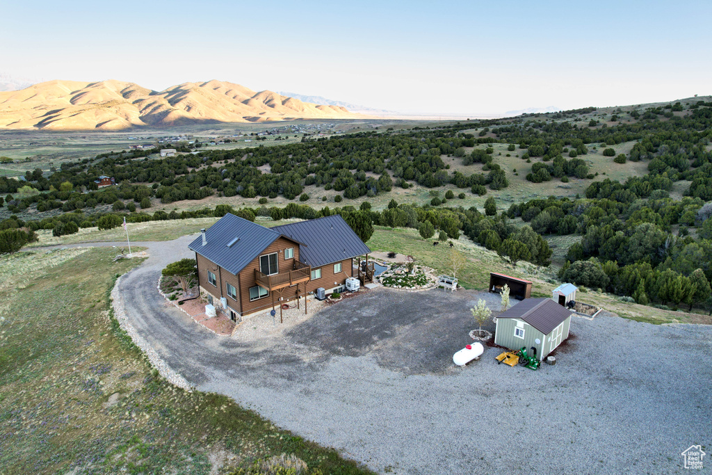 Birds eye view of property with a mountain view