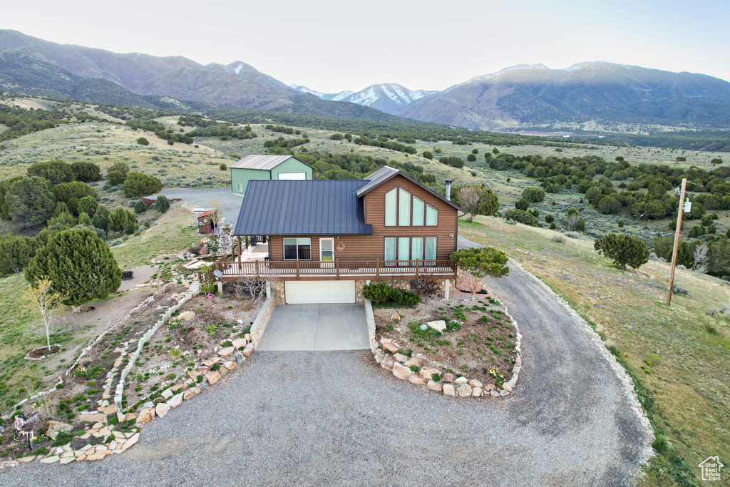 Birds eye view of property with a mountain view