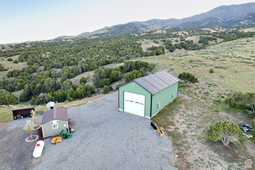 Birds eye view of property with a mountain view