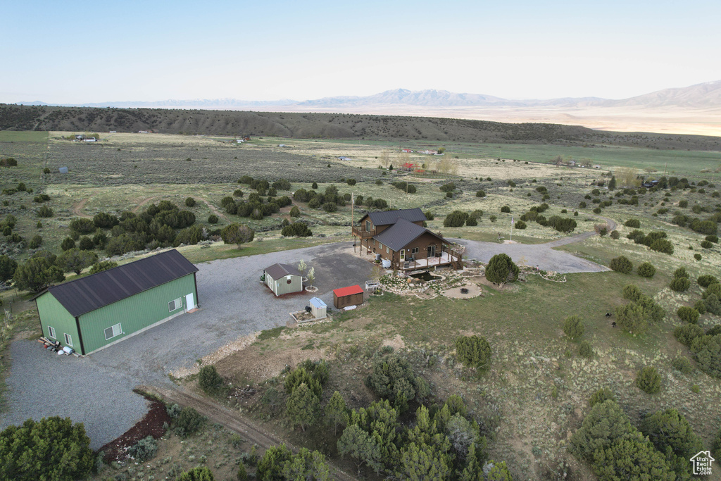 Drone / aerial view with a mountain view and a rural view