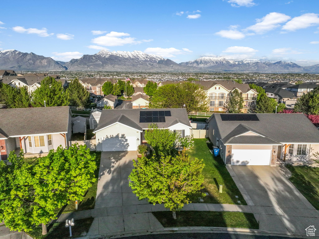 Birds eye view of property featuring a mountain view and a residential view