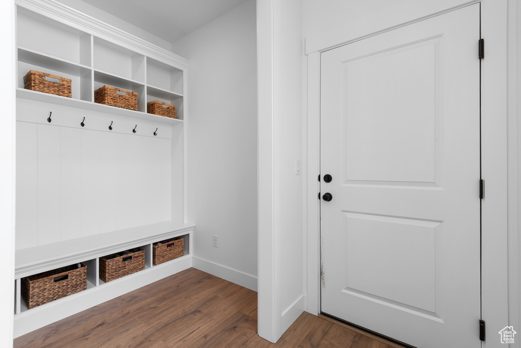 Mudroom with baseboards and dark wood-style flooring