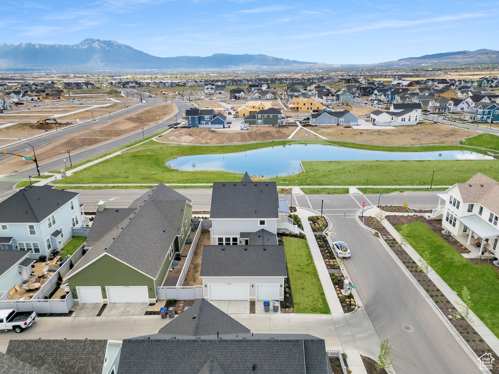Aerial view of residential area featuring a water and mountain view