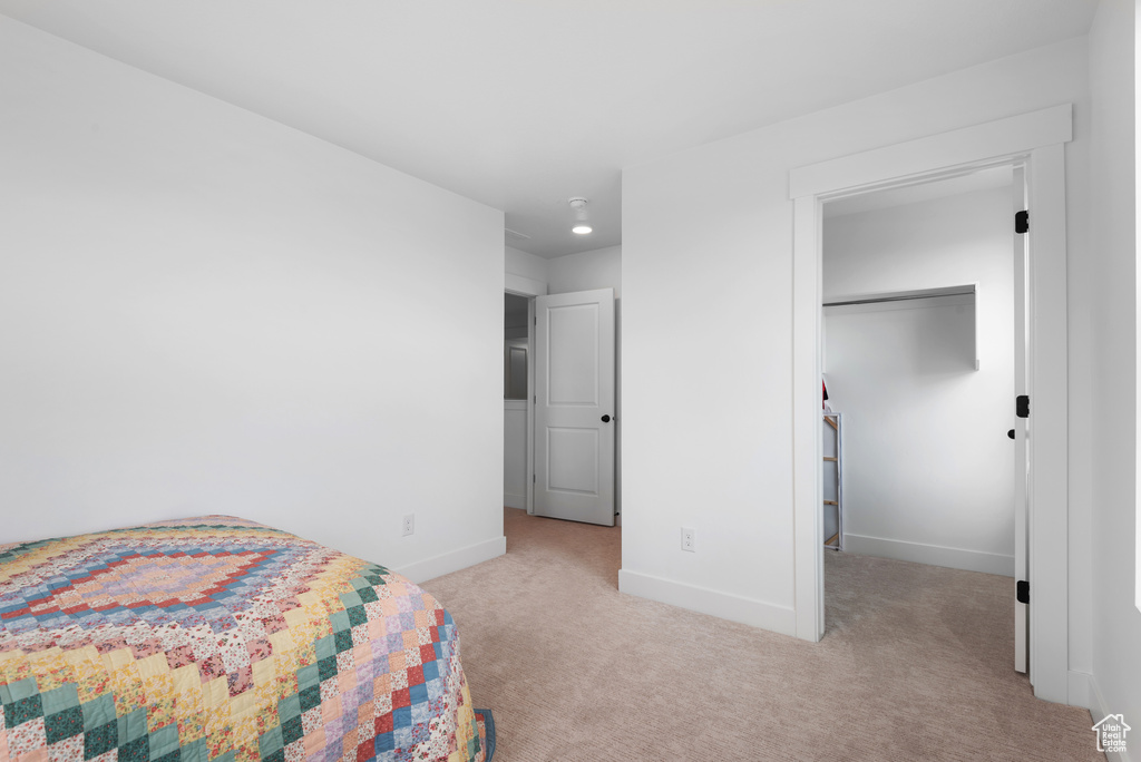 Bedroom featuring baseboards and carpet flooring