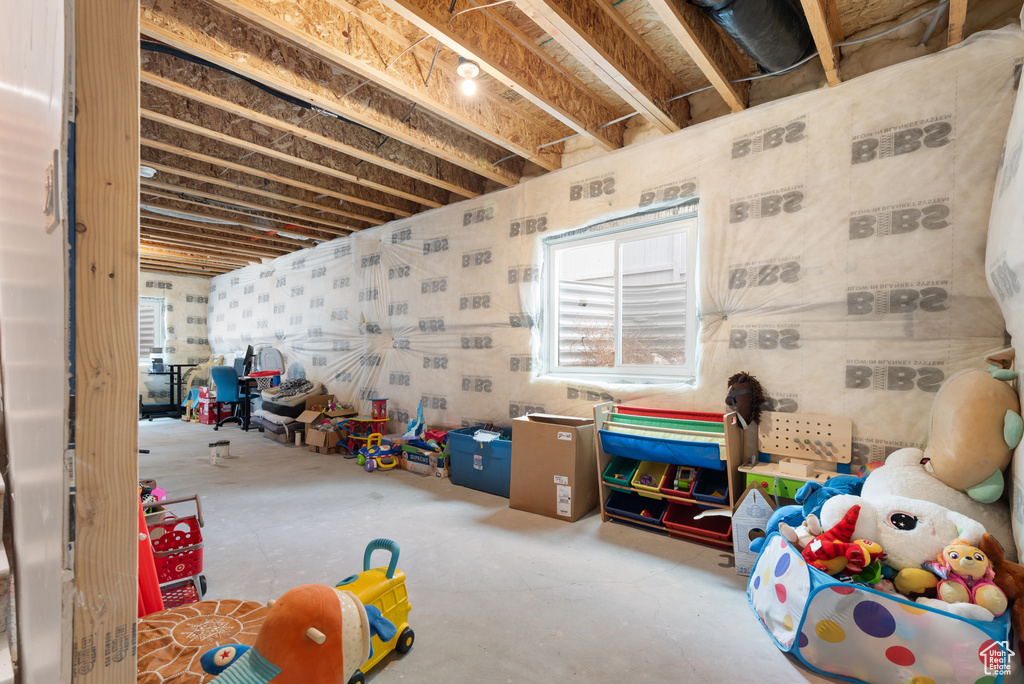 Playroom with unfinished concrete floors