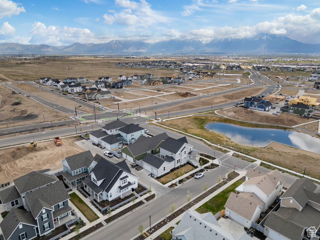 Birds eye view of property featuring a residential view and a water and mountain view