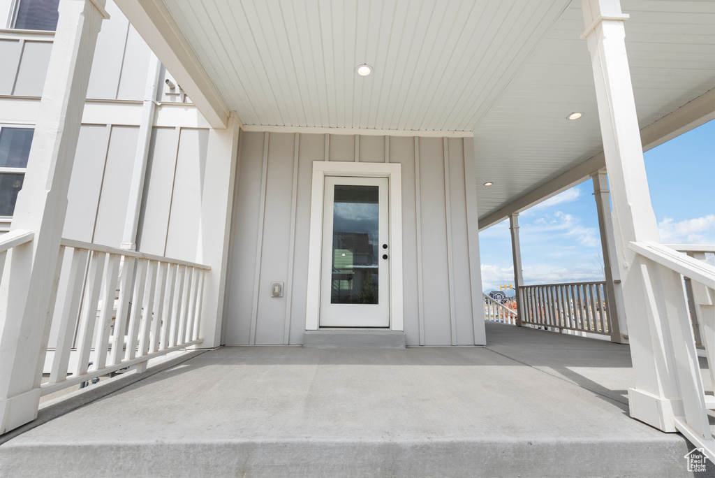 Property entrance with board and batten siding