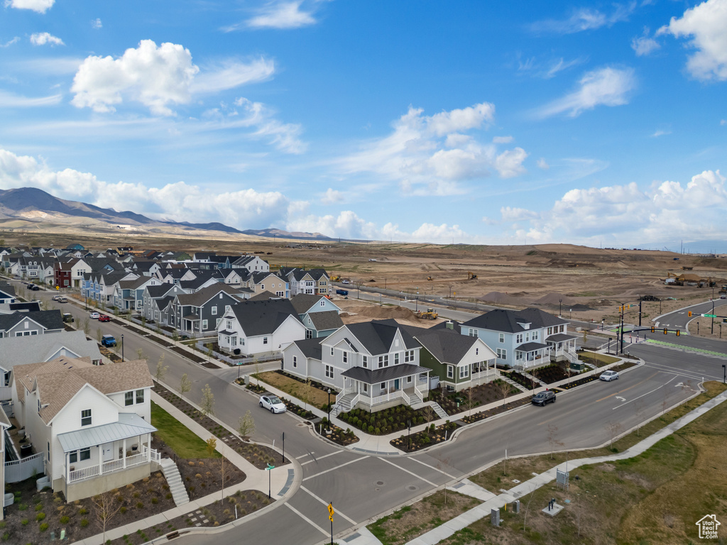 Birds eye view of property with a residential view and a mountain view