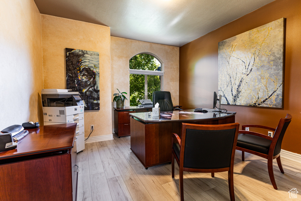 Office featuring baseboards and light wood-style floors