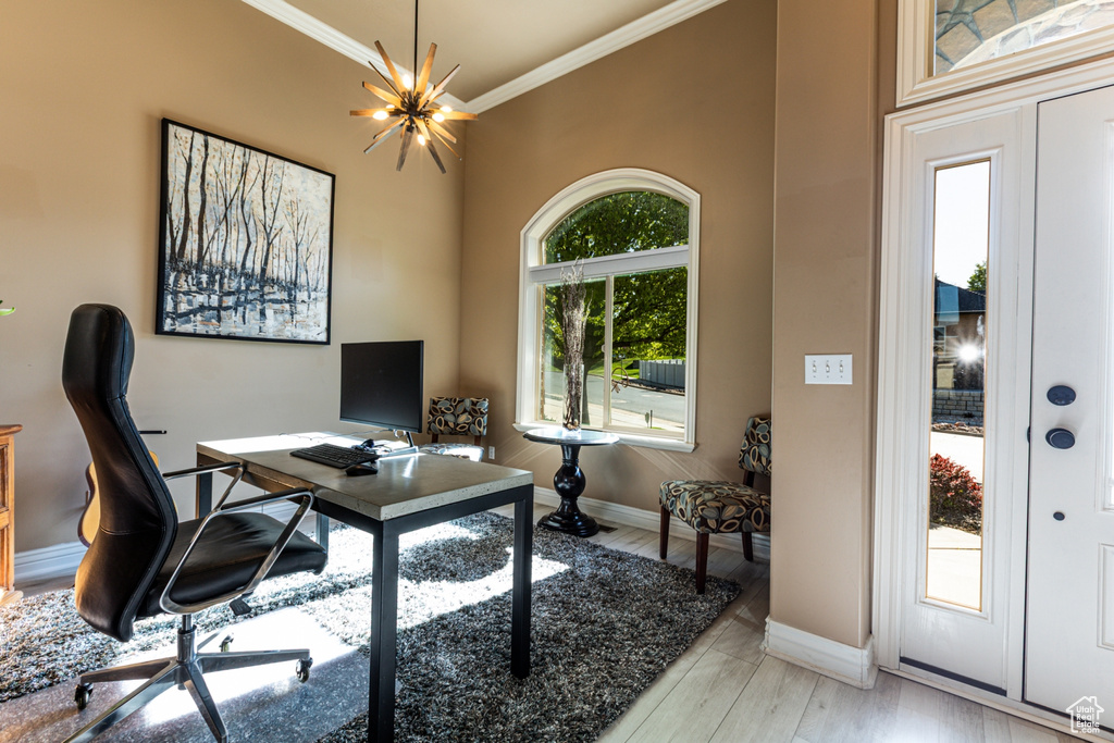 Office featuring crown molding, baseboards, and an inviting chandelier