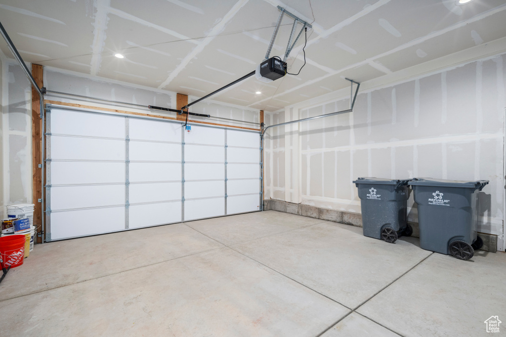 Garage featuring a garage door opener