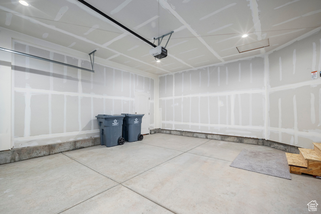 Garage featuring a garage door opener