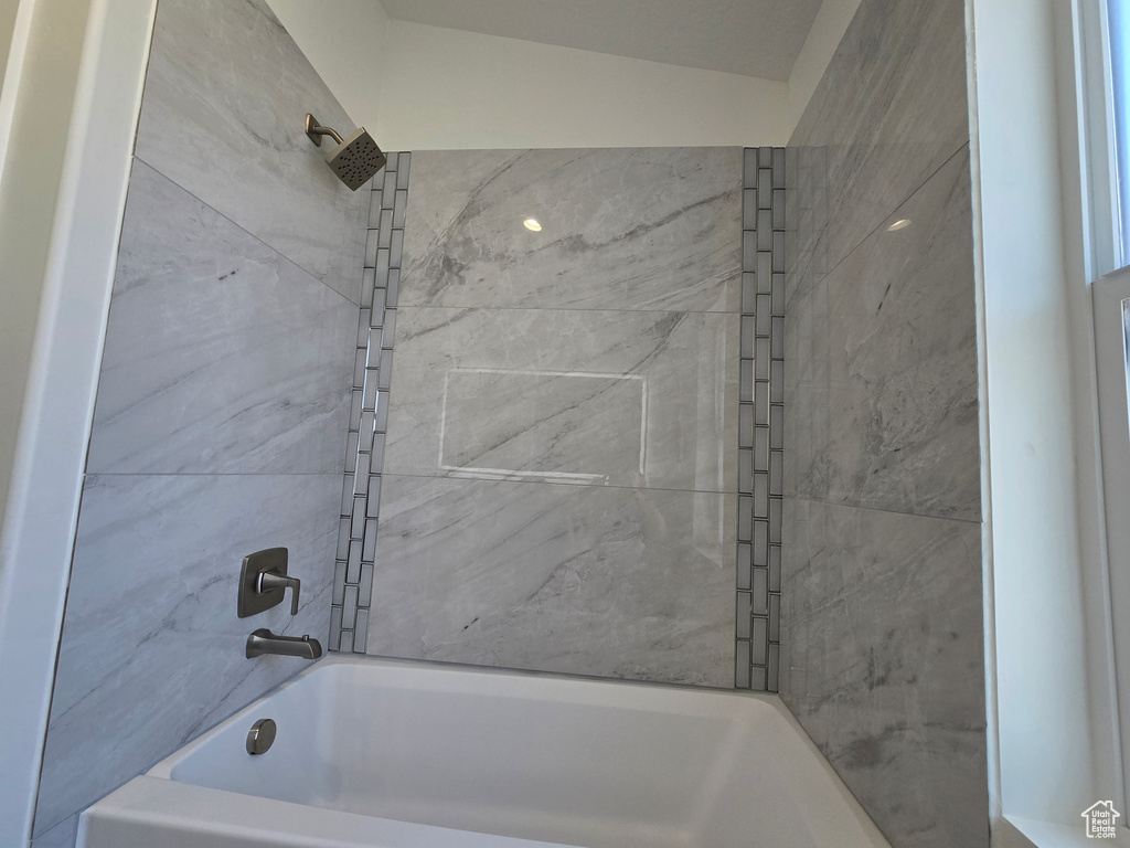 Full bathroom with tub / shower combination