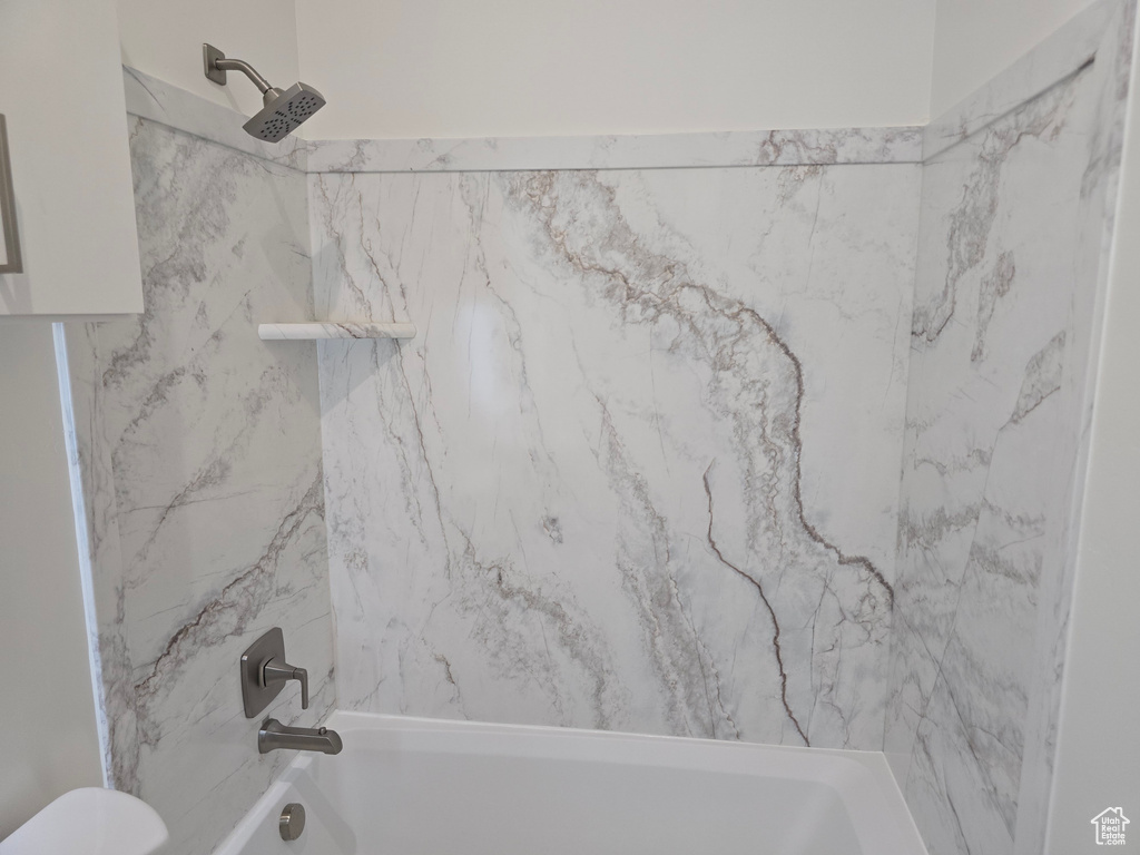 Full bath with toilet and shower / bath combination