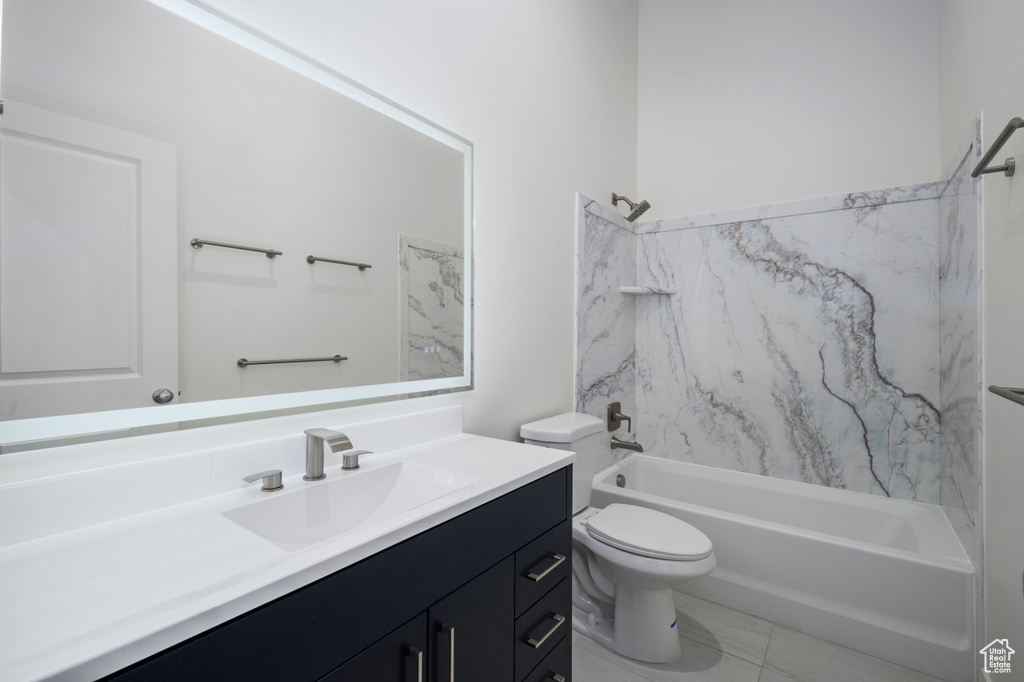 Full bath with vanity, bathtub / shower combination, toilet, and marble finish floor