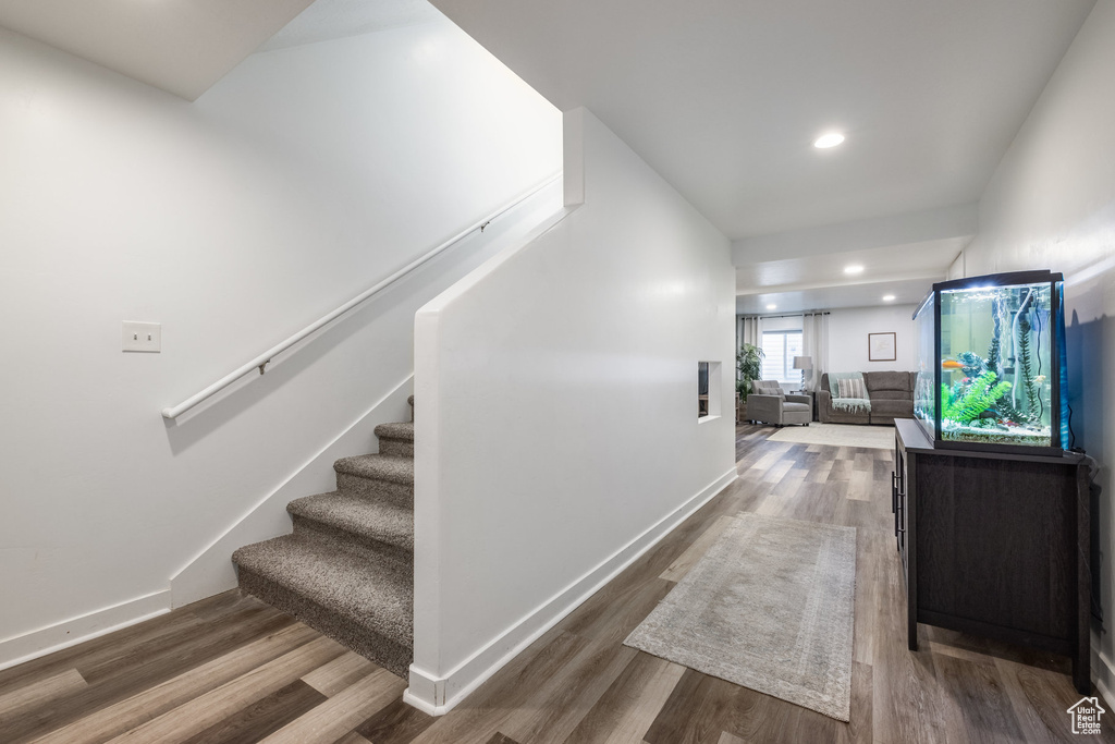 Interior space with baseboards and wood finished floors