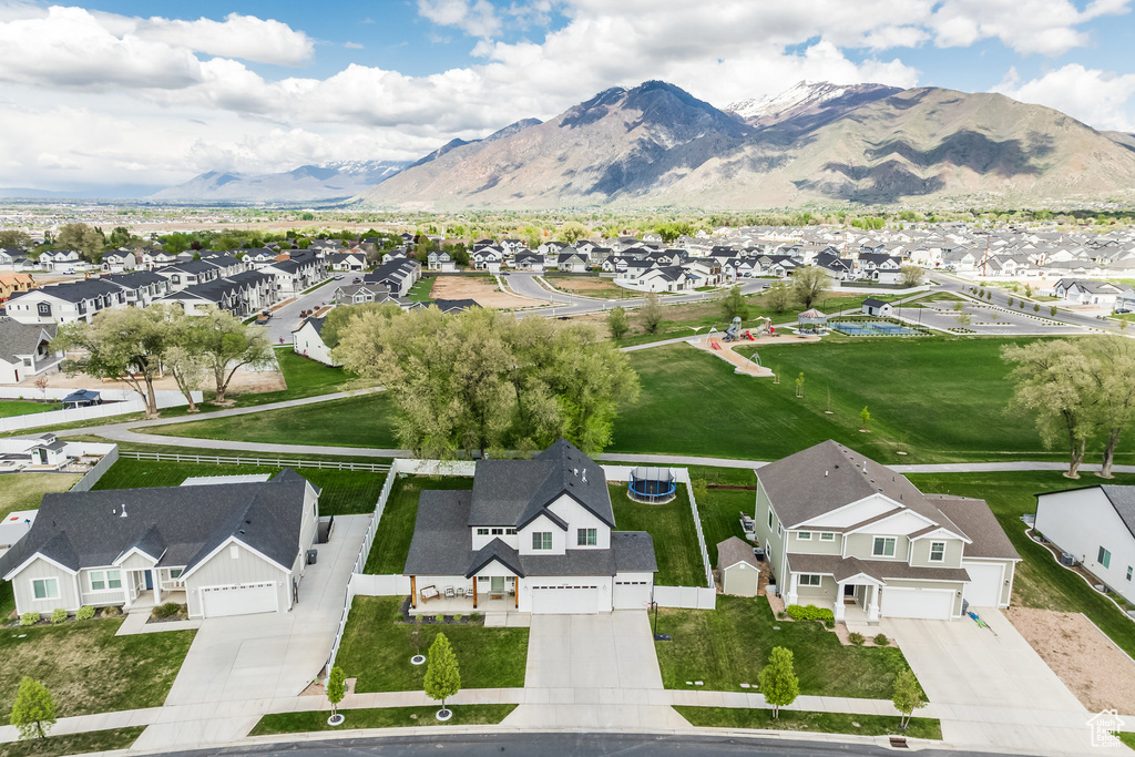 Birds eye view of property with a residential view and a mountain view