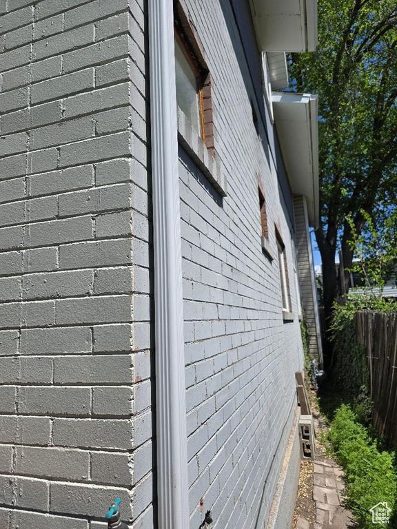 View of side of property with fence