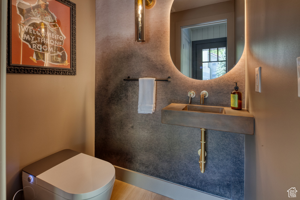 Bathroom featuring wood finished floors
