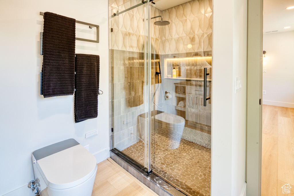 Bathroom with toilet and a shower stall