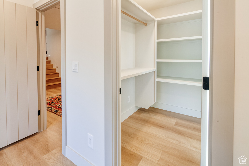 Spacious closet with wood finished floors
