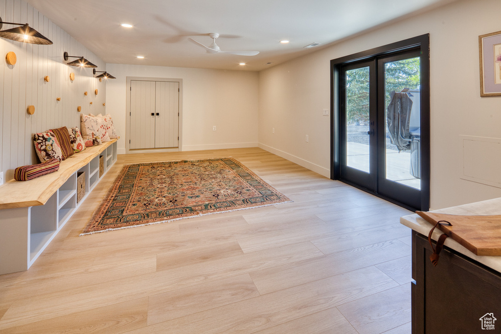 Interior space featuring recessed lighting, ceiling fan, french doors, and light wood-style flooring